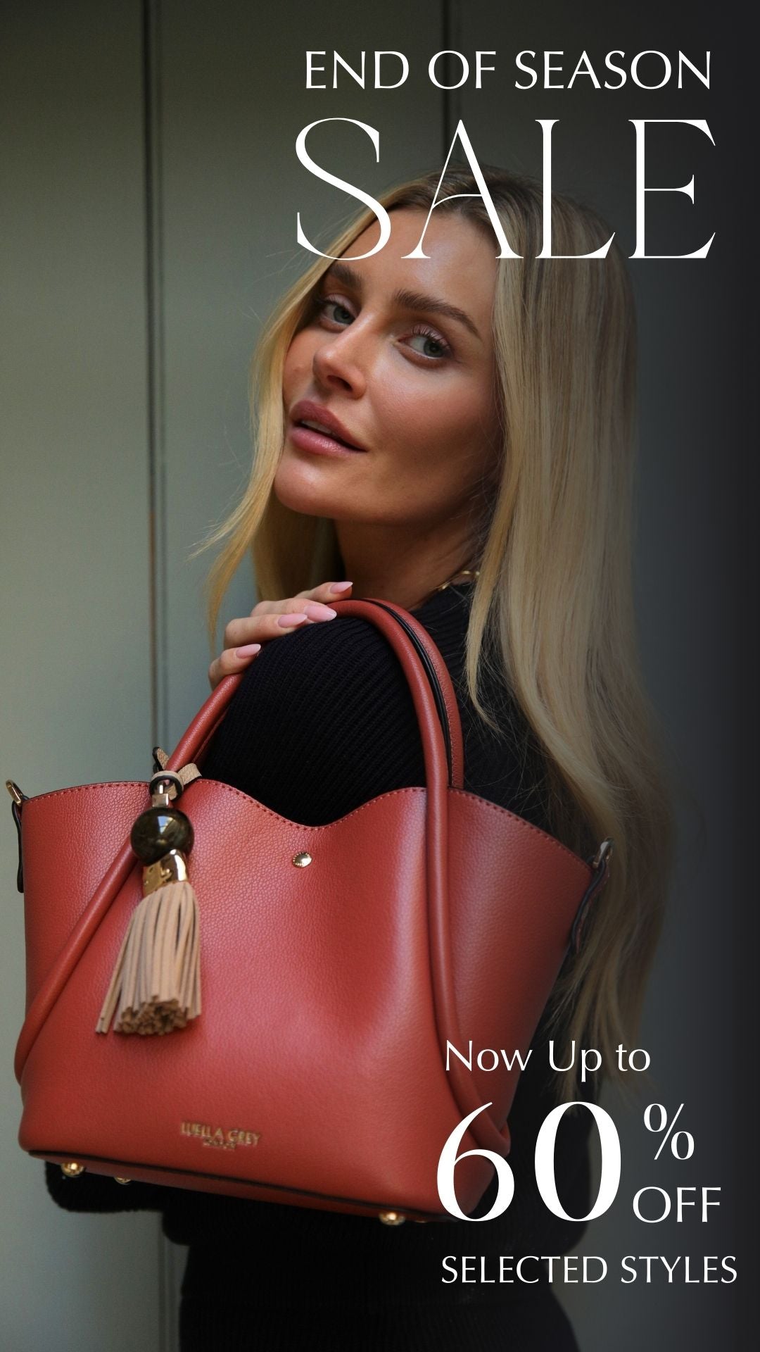 End of Season Sale up to 50% off model holding a chocolate tote bag 