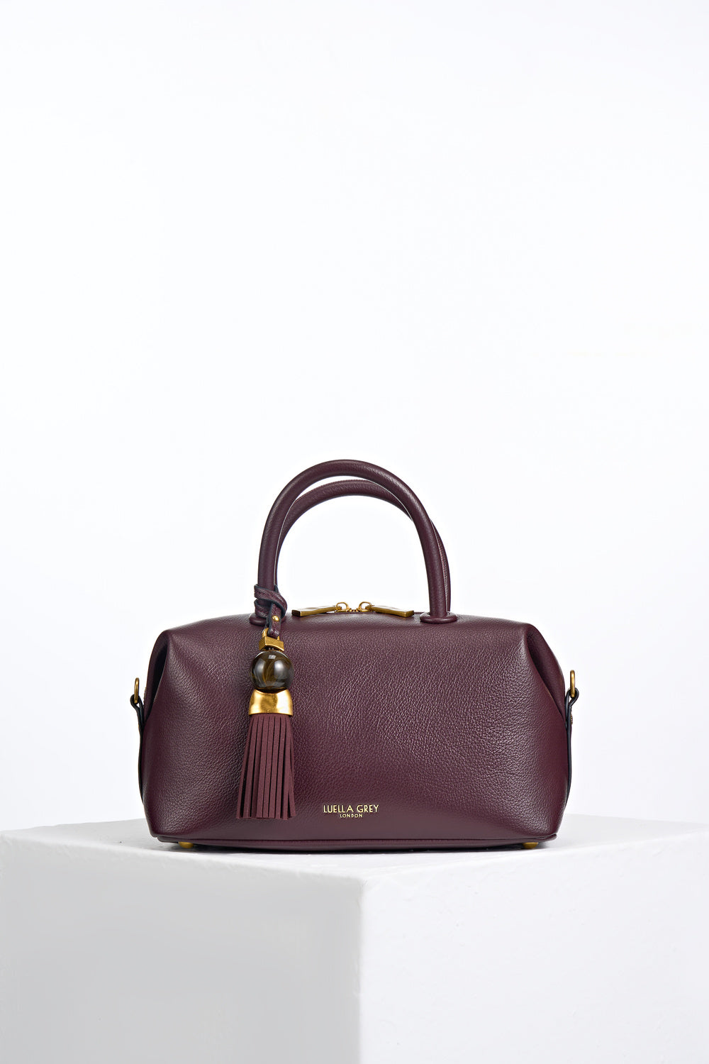 Alessia Black Cherry faux leather Bowler Tote by Luella Grey with Thames Tassel molten gold and resin detail attached to the grab handles