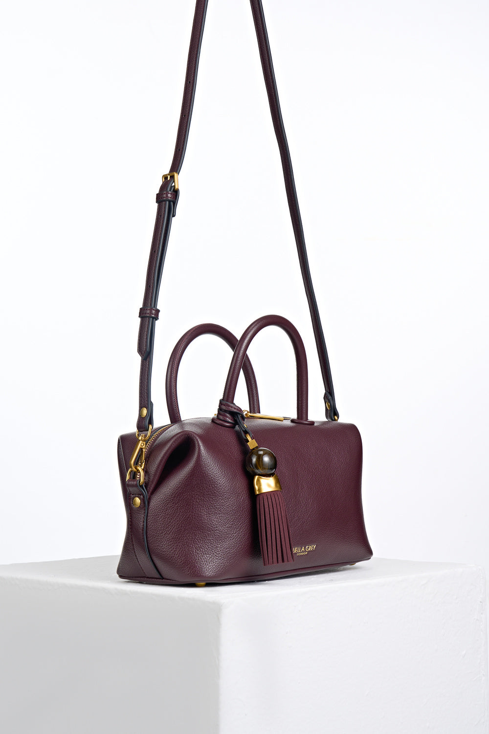 Alessia Black Cherry faux leather Bowler Tote by Luella Grey with detachable crossbody strap attached to gold rings on the side