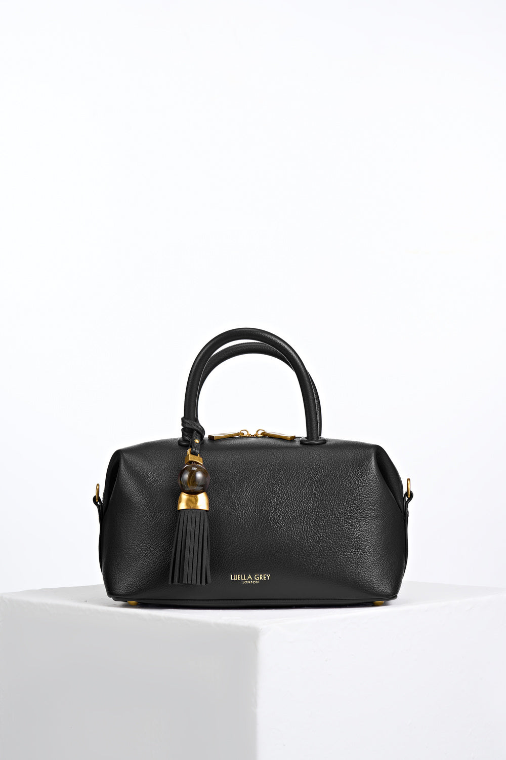 Alessia Black faux leather Bowler Tote by Luella Grey with Thames Tassel molten gold and resin detail attached to the grab handles