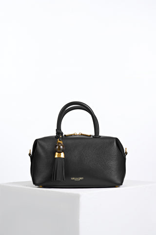 Alessia Black faux leather Bowler Tote by Luella Grey with Thames Tassel molten gold and resin detail attached to the grab handles