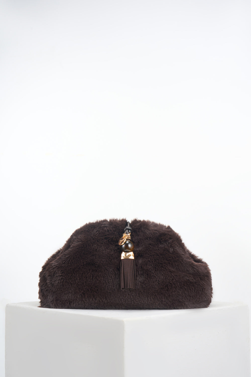 Front of Indigo Chocolate Faux Fur Oversized Clutch showing the Signature Thames Tassel closure detail 