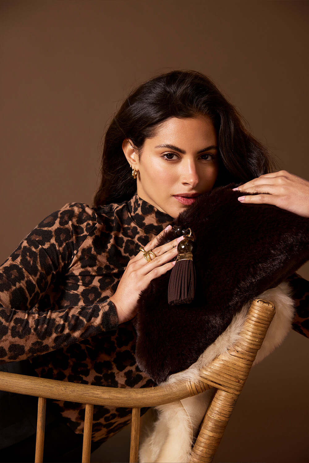 Female model holding Indigo Chocolate Faux Fur Oversized Clutch =