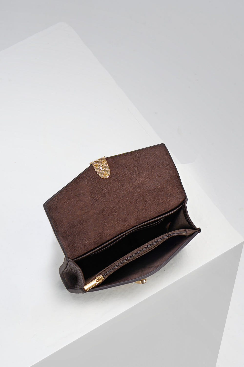 Inside of Leontina Chocolate Medium Purse showing the zip top coin compartment and interior card slots