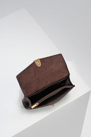 Inside of Leontina Chocolate Medium Purse showing the zip top coin compartment and interior card slots