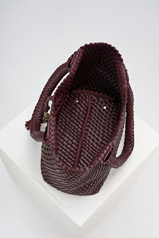 Overhead view of the inside of Saskia Black Cherry faux leather Woven Tote 