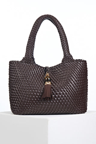 Front view of Saskia Chocolate faux leather Woven Tote with Thames Tassel closure detail