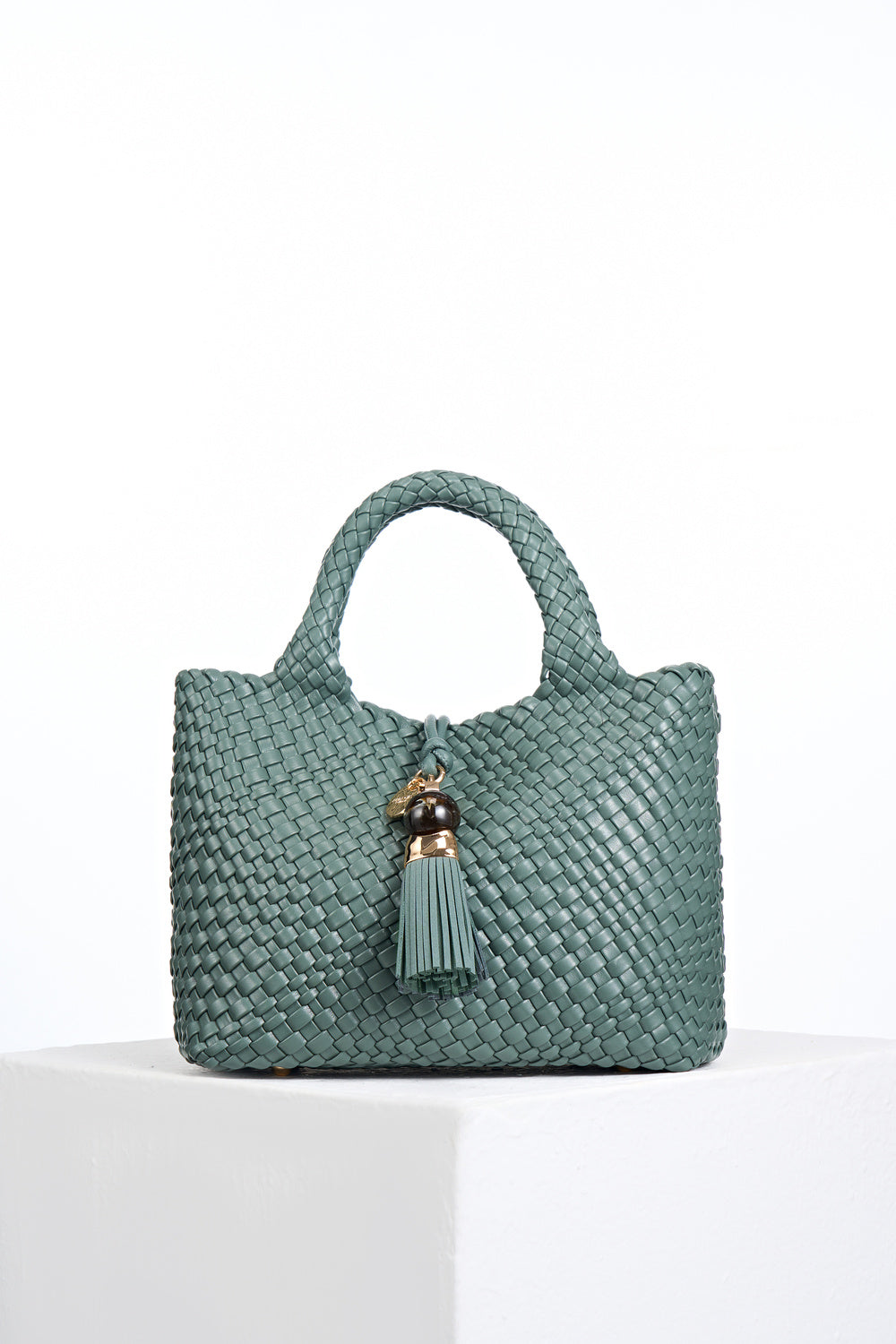Suky Steel Green faux leather Woven Crossbody with Signature Thames Tassel closure detail