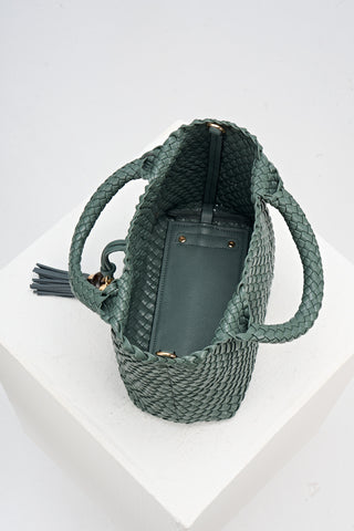 Overhead view of Suky Steel Green faux leather Woven Crossbody 