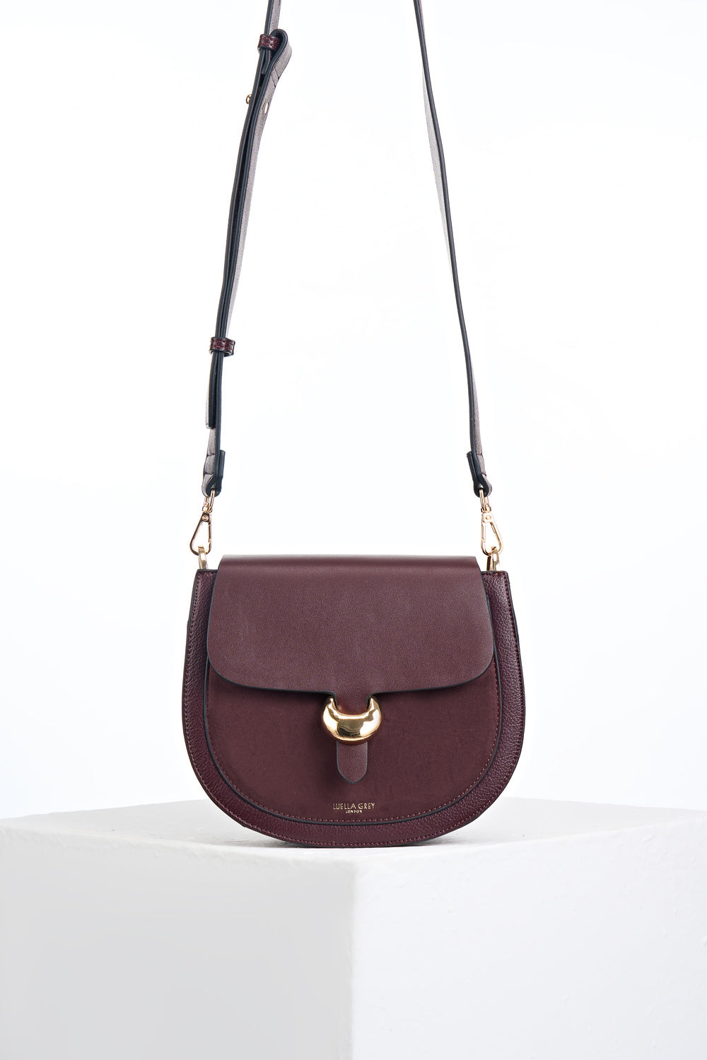 Venetia Black Cherry Faux leather Saddle Crossbody with gold Cannon Street Clasp Closure detail on the front flap