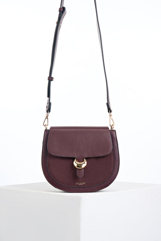 Venetia Black Cherry Faux leather Saddle Crossbody with gold Cannon Street Clasp Closure detail on the front flap