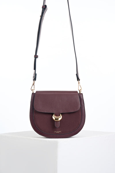 Venetia Black Cherry Faux leather Saddle Crossbody with gold Cannon Street Clasp Closure detail on the front flap