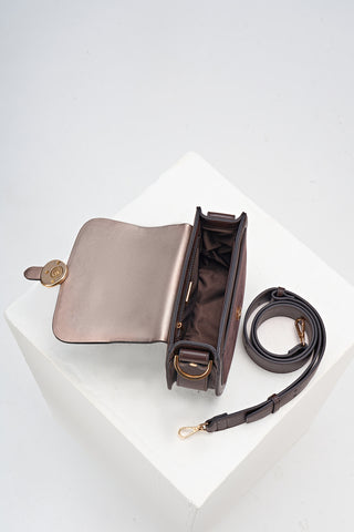 Overhead shot of the inside of Venetia Chocolate Faux leather Saddle Crossbody with detached crossbody strap
